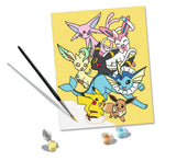 CreArt Ravensburger Pokémon Pikachu & Évoli, peinture par numéros 24 x 30 cm avec Pikachu, Évoli et plusieurs Évolitions sur fond jaune.