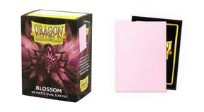 Boîte Dragon Shield Dual Matte Blossom contenant 100 protège-cartes standard roses avec intérieur noir et finition mate.