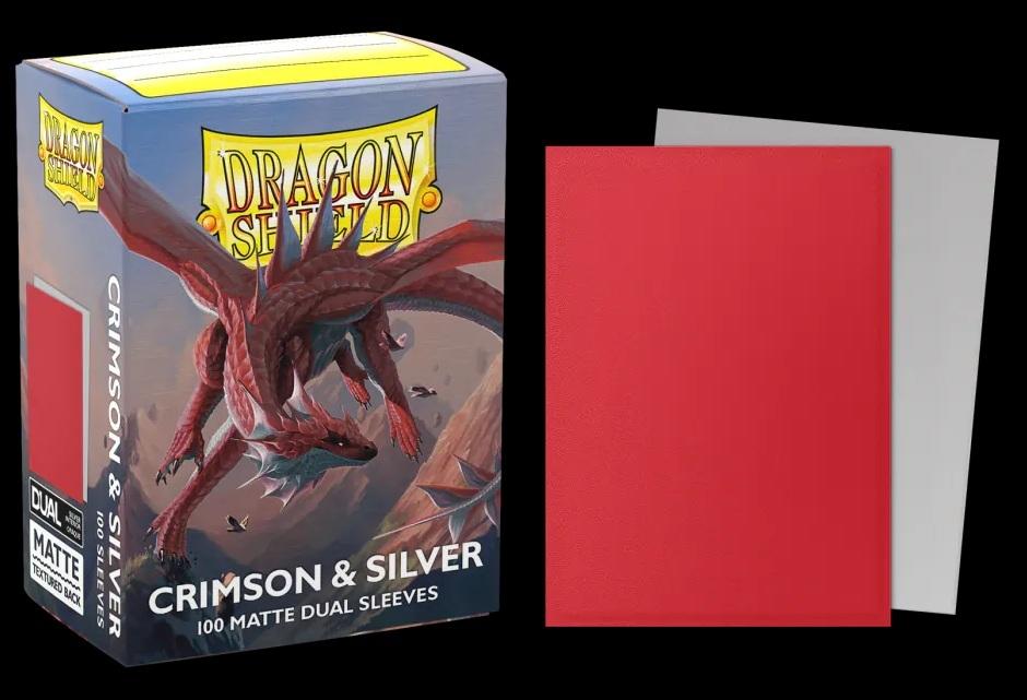 Boîte Dragon Shield Dual Matte Crimson & Silver contenant 100 protège-cartes standard rouges avec intérieur argenté et finition mate.