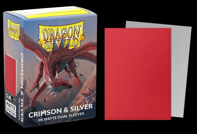 Boîte Dragon Shield Dual Matte Crimson & Silver contenant 100 protège-cartes standard rouges avec intérieur argenté et finition mate.