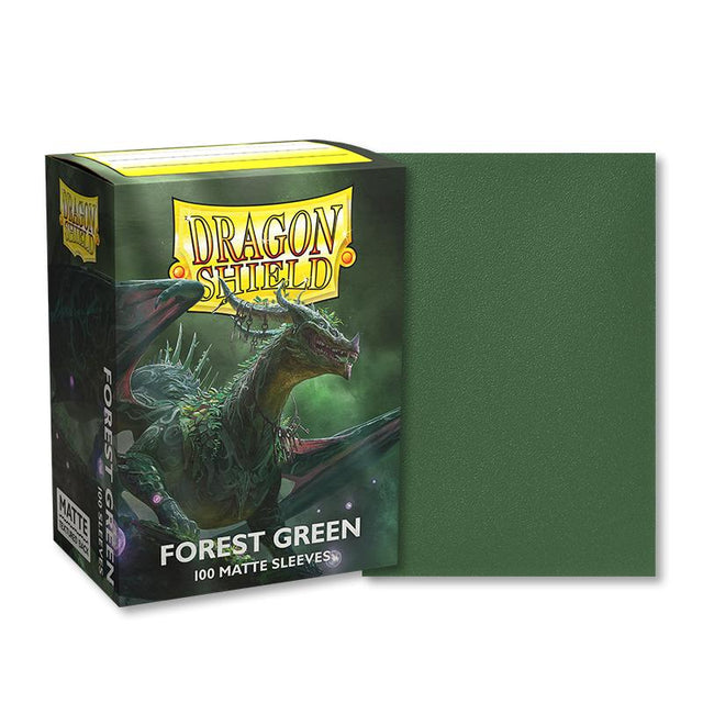 Boîte de 100 protège-cartes Dragon Shield Forest Green Matte au format standard, avec illustration d'un dragon vert sur le packaging et aperçu d'une sleeve vert forêt à finition mate.
