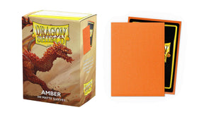 Boîte Dragon Shield Matte Sparkle Amber contenant 100 protège-cartes standard orange ambré scintillants avec finition mate.