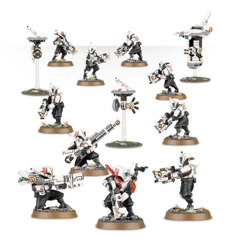 Boîte de l’Équipe de Cibleurs T’au (Pathfinder Team) pour Warhammer 40,000. Ce kit contient 10 figurines de Pathfinders, accompagnées de drones de soutien et d’un poste d’observation avancé pour des missions de reconnaissance tactique.