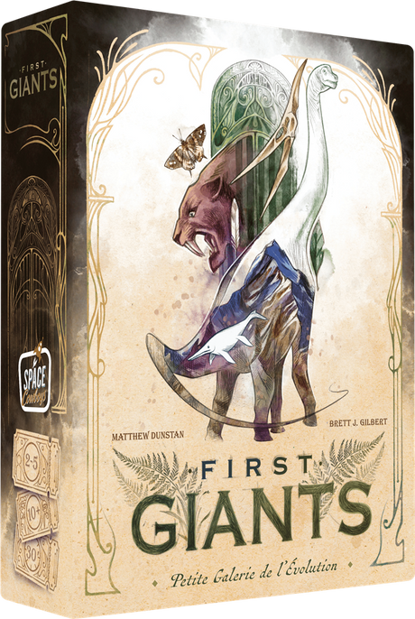 Boîte du jeu First Giants avec illustration d’animaux préhistoriques stylisés, dont un dinosaure, un mammouth et un ptérosaure.