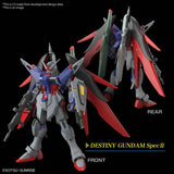 Maquette Gunpla HG 1/144 Destiny Gundam Spec II & Zeus Silhouette avec armement géant, ailes rouges et blanches sur fond blanc.