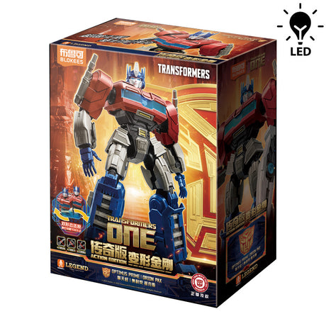 Boîte Transformers Blokees Action Edition One Optimus Prime / Orion Pax avec visuel du robot rouge et bleu et mention LED.