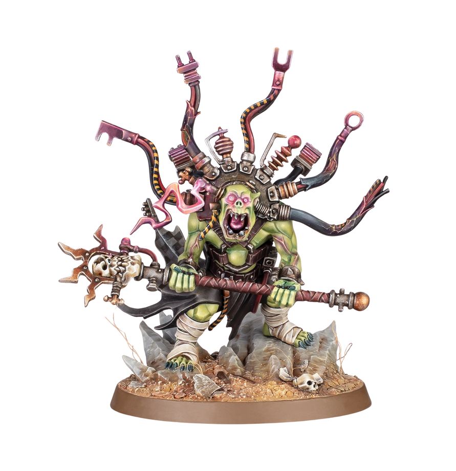Figurine Warhammer 40,000 Orks Bizarboy, psyker ork avec bâton, câbles et équipement étrange sur socle décoré.